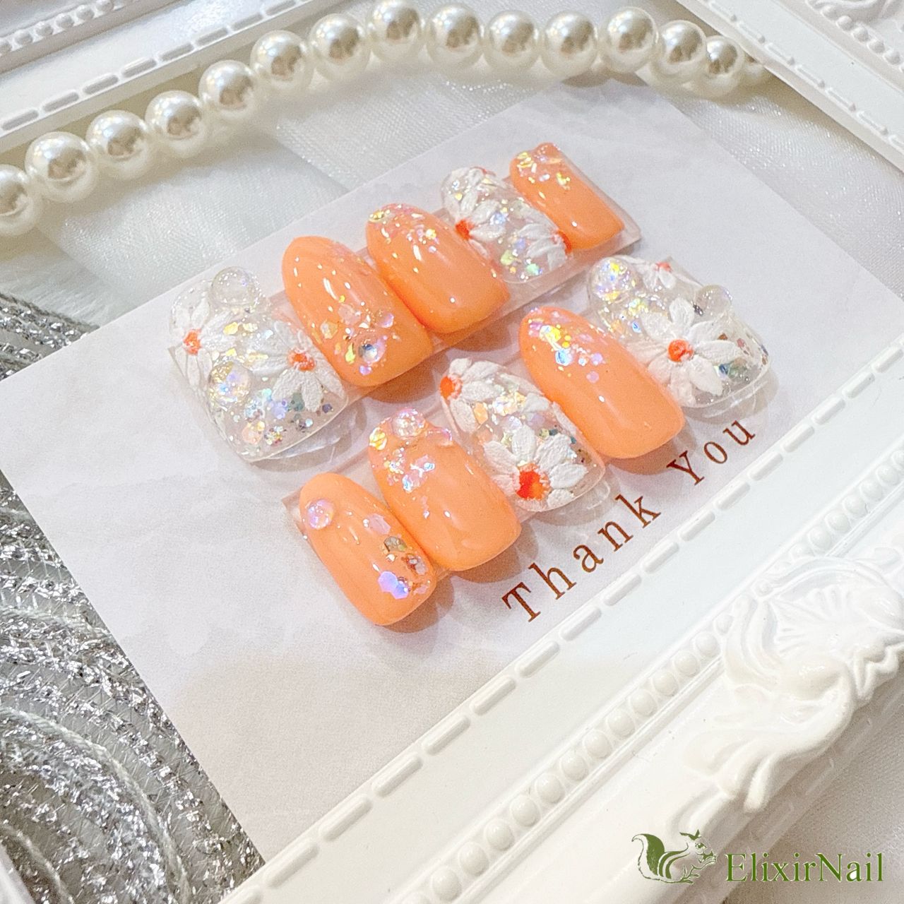 現品】ネイルチップ オレンジ 花柄 ホワイト - メルカリ