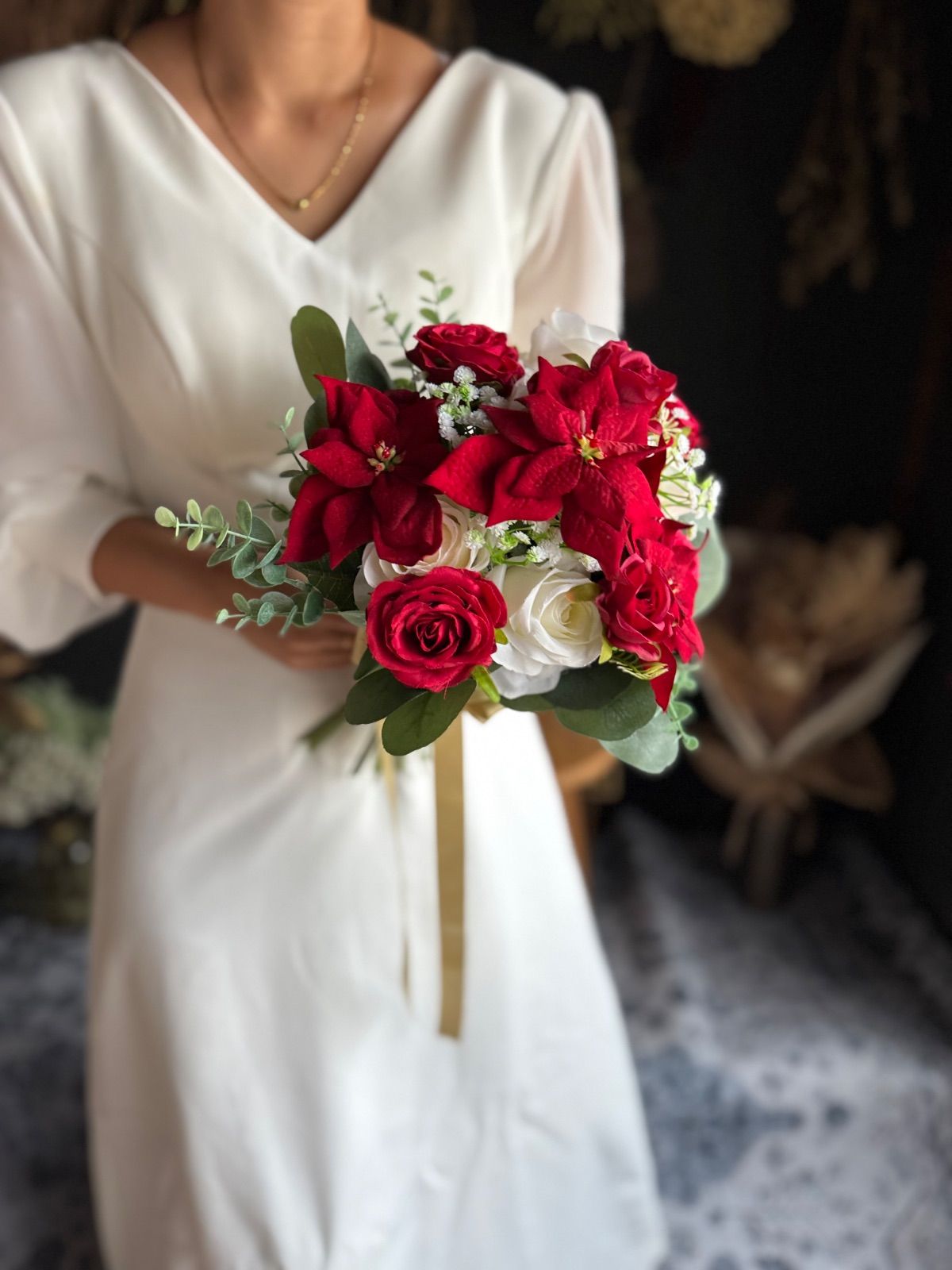 ポインセチアクラッチブーケ ブートニア