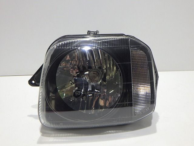ジムニー 左ヘッドライト ハロゲン JB23W レベ付 100-32647 L コーティング 250910063