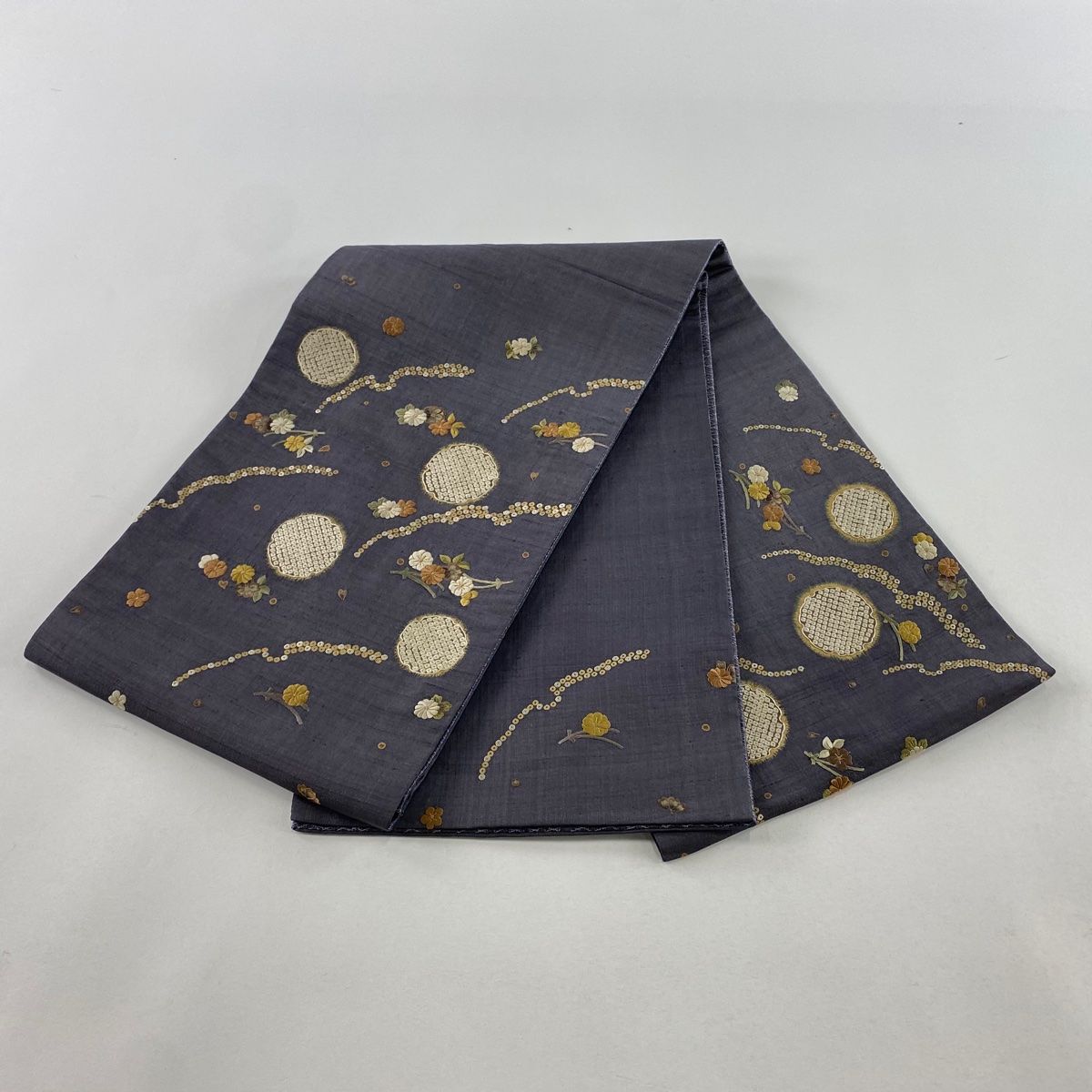 袋帯 美品 名品 紬地 雪輪 草花 刺繍 金糸 灰紫 お太鼓柄 正絹
