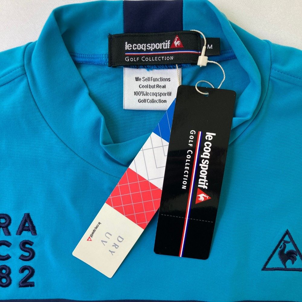 サイズ：L LE COQ GOLF ルコックゴルフ  ハイネック 長袖Tシャツ  ブルー系 [240101483356] ゴルフウェア メンズ ストスト サイズ：L LE COQ GOLF ルコックゴルフ ハイネック 長袖Tシャツ