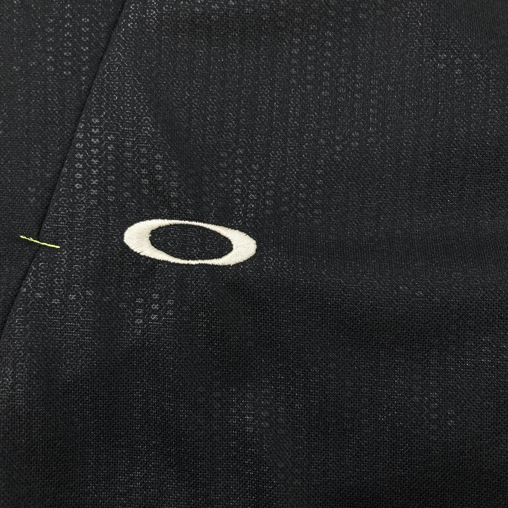 サイズ：XL OAKLEY オークリー 433047JP 半袖ポロシャツ ボタンダウン 総柄 ブラック系 [240101451235] ゴルフウェア メンズ ストスト サイズ：XL OAKLEY オークリー 433047JP 半袖ポロシャツ ボタン