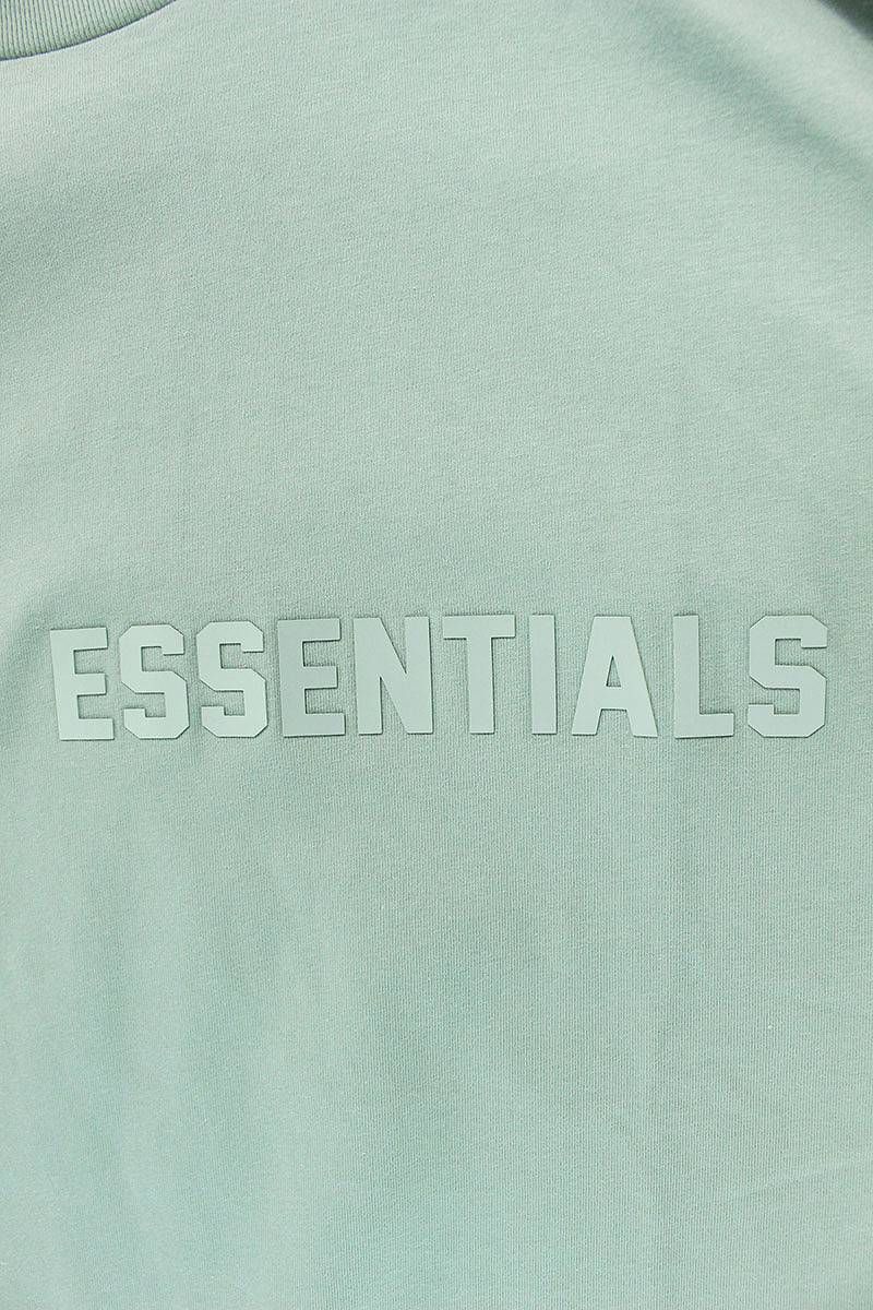 フォグ ESSENTIALS L/S Tee Sycamore フロントラバーロゴ長袖