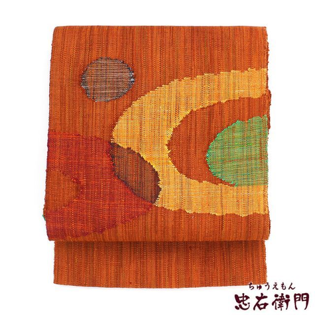 八寸名古屋帯紬　橙色花模様　底しょうざん生紬帯　煉瓦色　リメイク　竹ハンドル 名古屋帯 なごや帯 リサイクル レディース 正絹 オレンジ 紬