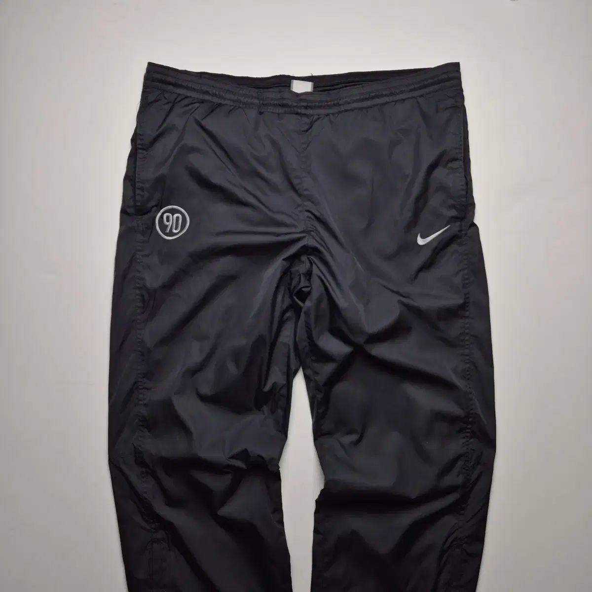 Nike t90 pants online