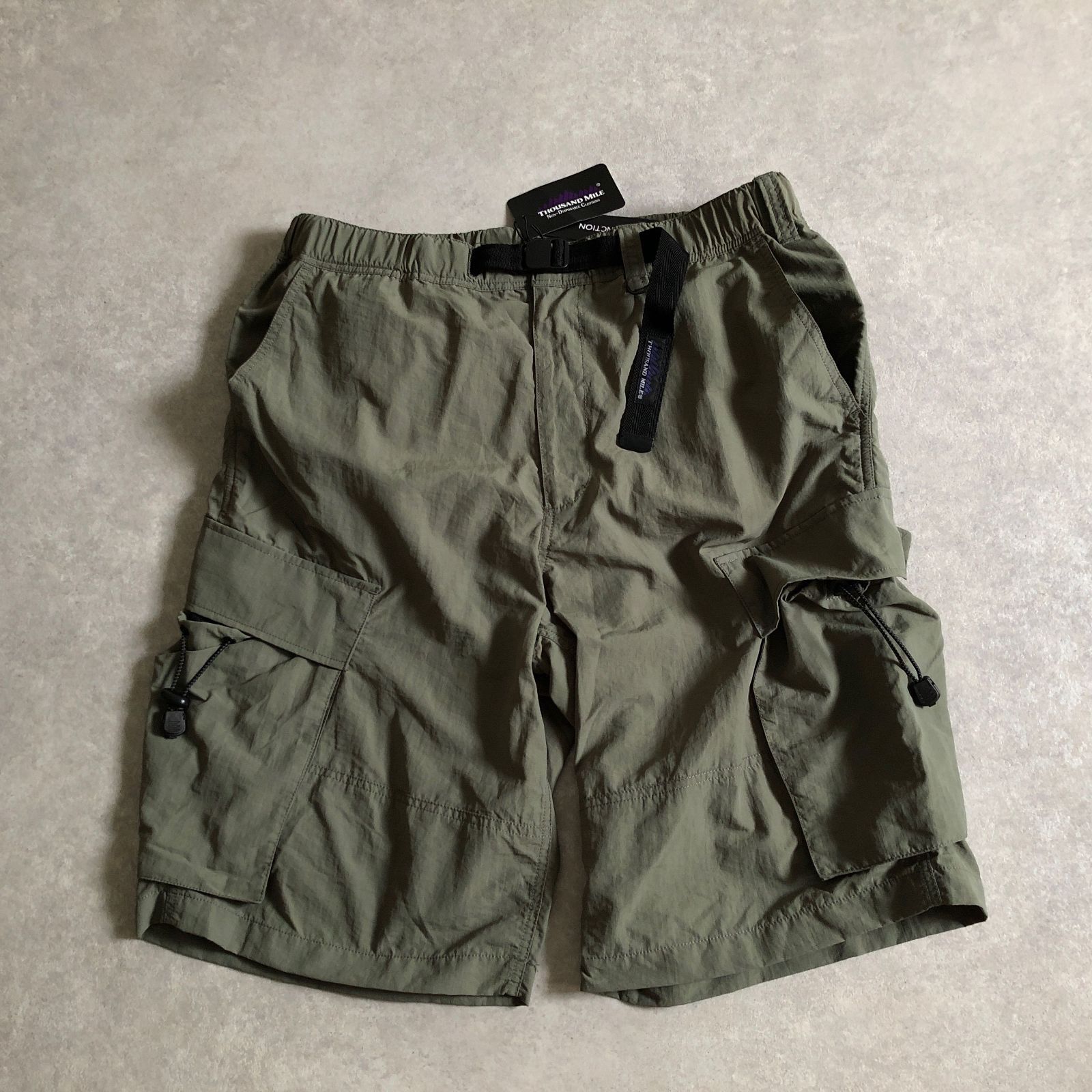 未使用 THOUSAND MILE SYNCPACK SHORT PANTS サウザンドマイル カーゴ ショーツ - メルカリ