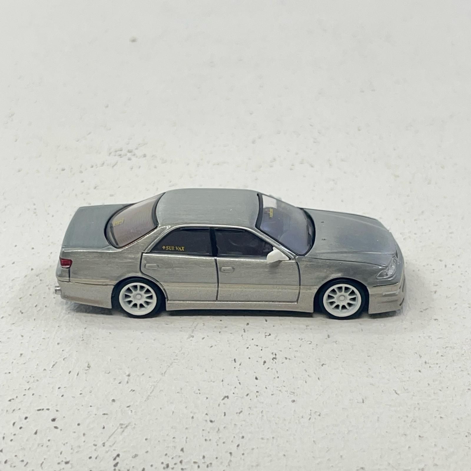 ターマックワークス 1/64 ベルテックスマーク2JZX100 ホワイト Amazon | TARMACWORKS 1/64 VERTEX Toyota Mark II JZX100 Light