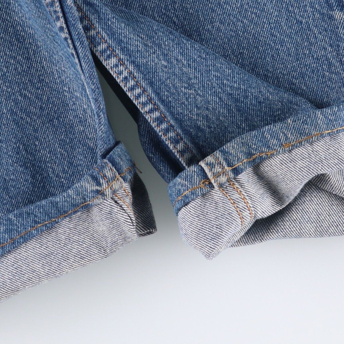 オレンジタブ テーパードデニムパンツ