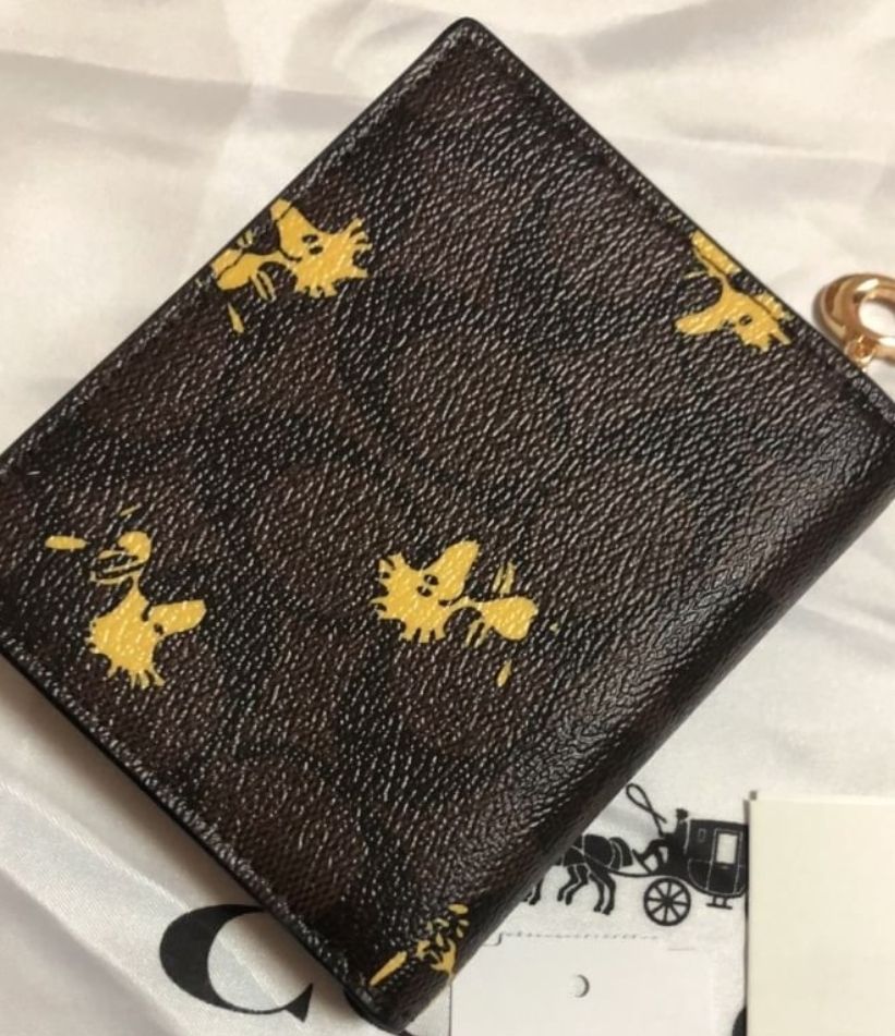 通販正規店 COACH×PEANUTS スナップウォレット ウッドストック柄