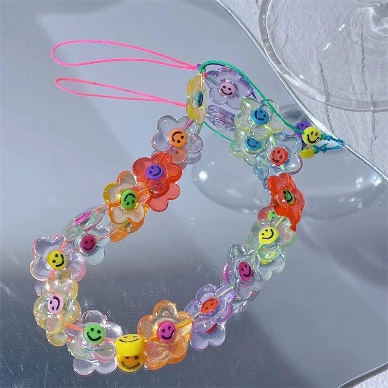 レトロなフラワーニコちゃんスマホストラップ♡ - メルカリ