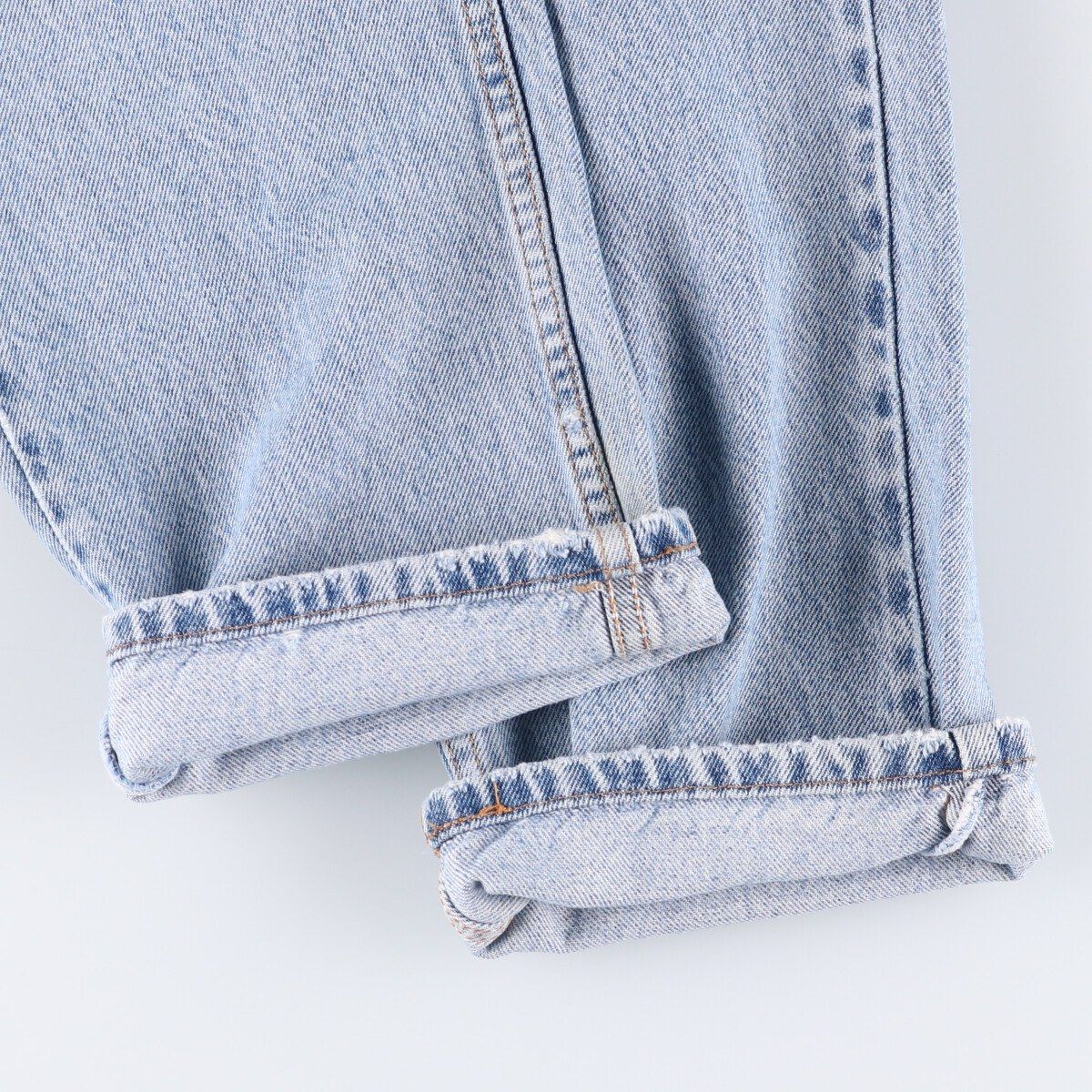 オレンジタブ テーパードデニムパンツ