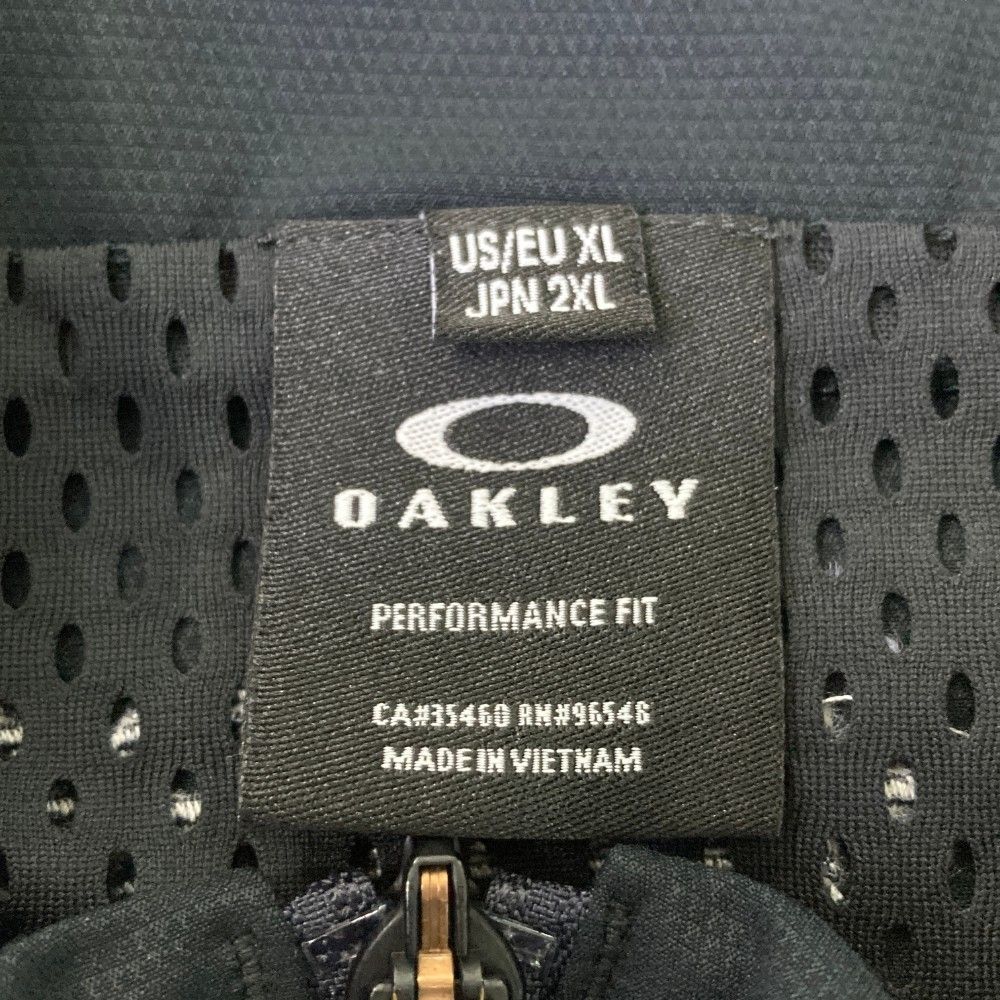 サイズ：2XL OAKLEY オークリー  2way ジップジャケット  ブラック系 [240101444976] ゴルフウェア メンズ ストスト サイズ：2XL OAKLEY オークリー 2way ジップジャケット ブラック