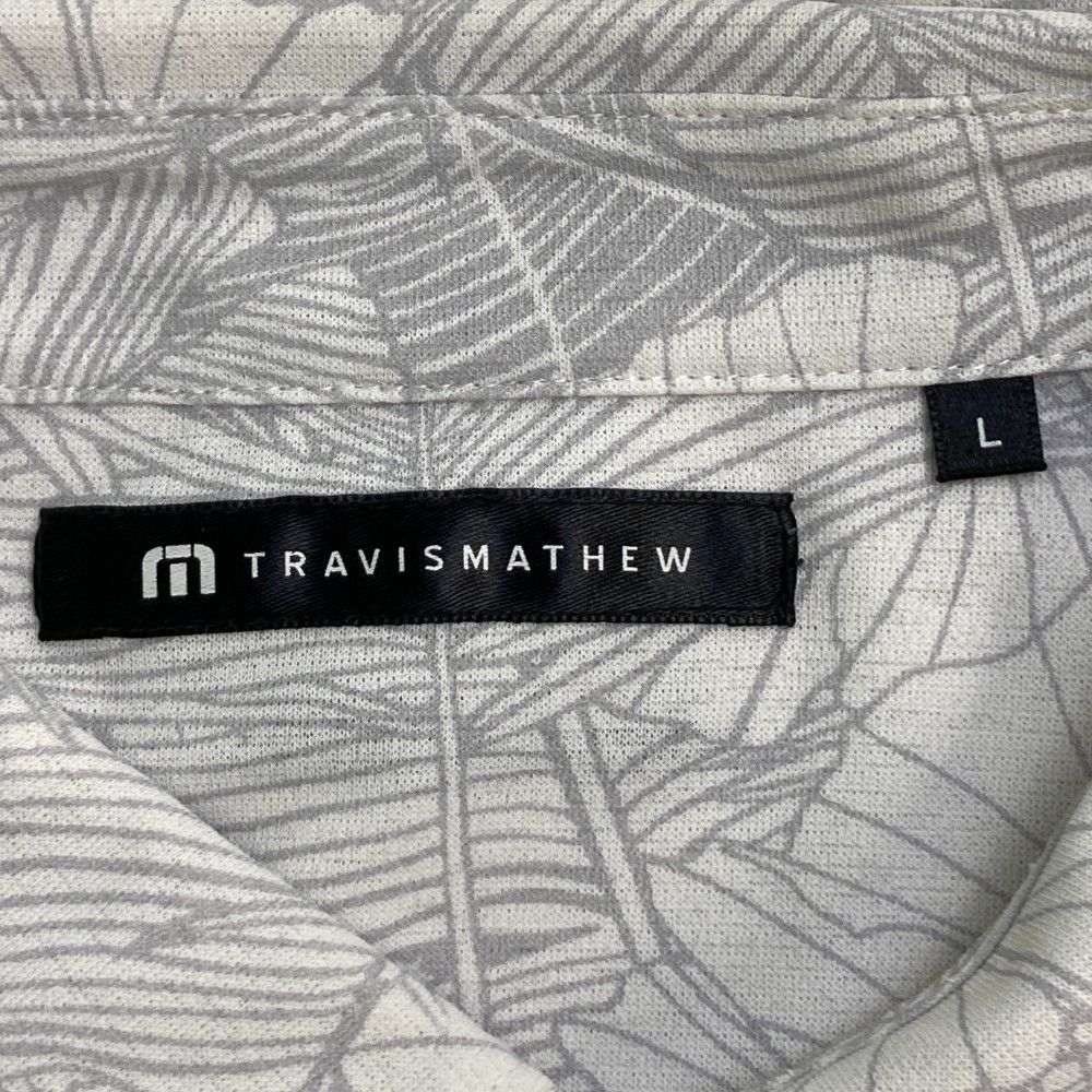 サイズ：L TRAVIS MATHEW トラビスマシュー  半袖ポロシャツ ボタニカル柄 ホワイト系 [240101448876] ゴルフウェア メンズ ストスト サイズ：L TRAVIS MATHEW トラビスマシュー 半袖ポロシャツ