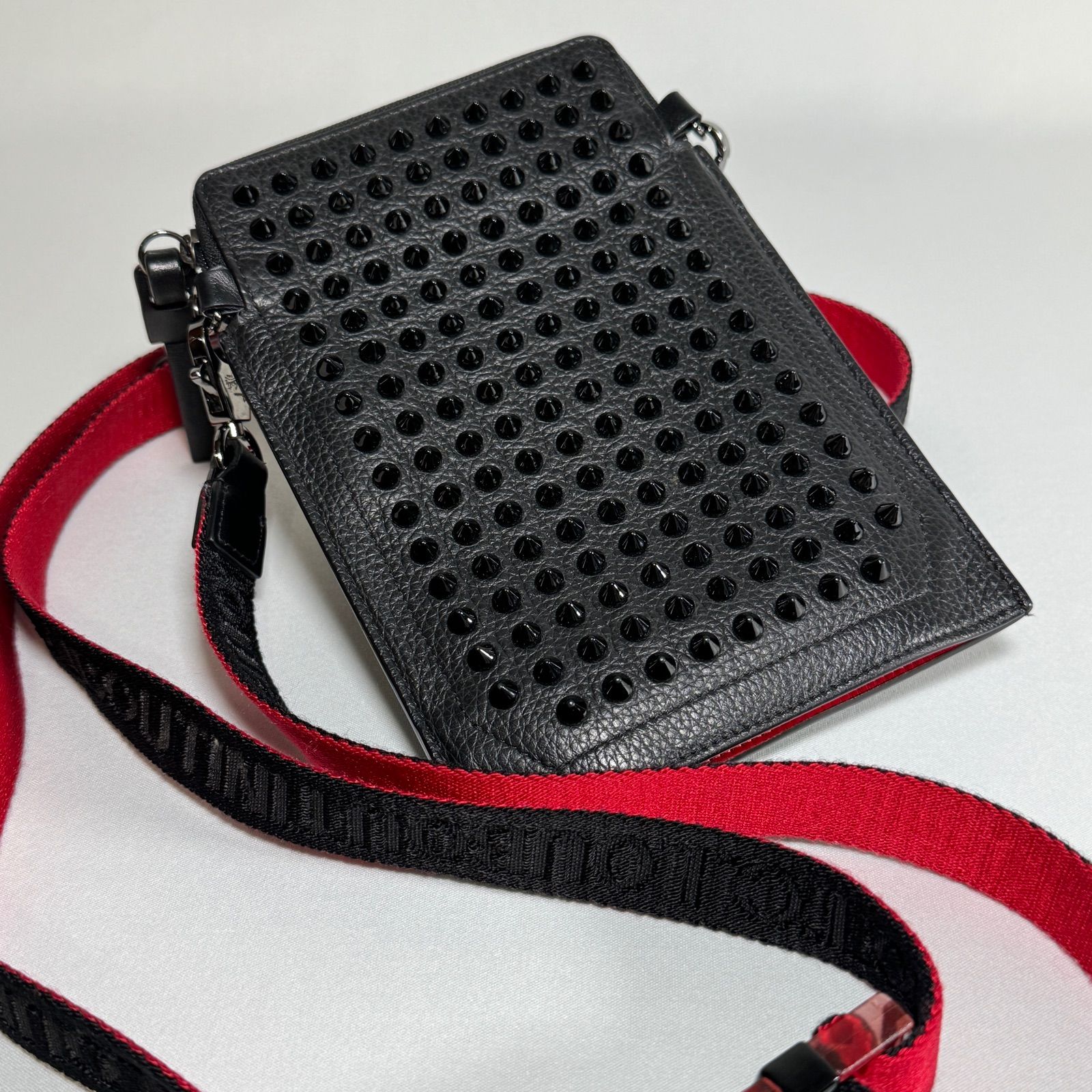 CHRISTIAN LOUBOUTINクリスチャンルブタンLoubilab phone pouch ...