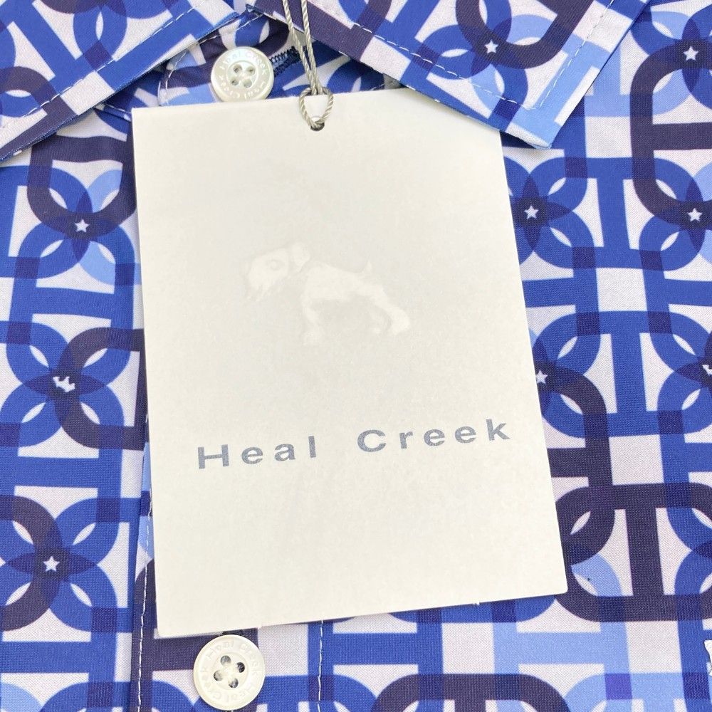 サイズ：48 HEAL CREEK ヒールクリーク  半袖ポロシャツ 総柄 ホワイト系 [240101449145] ゴルフウェア メンズ ストスト ヒールクリーク（HEAL CREEK）（レディース）ゴルフウェア