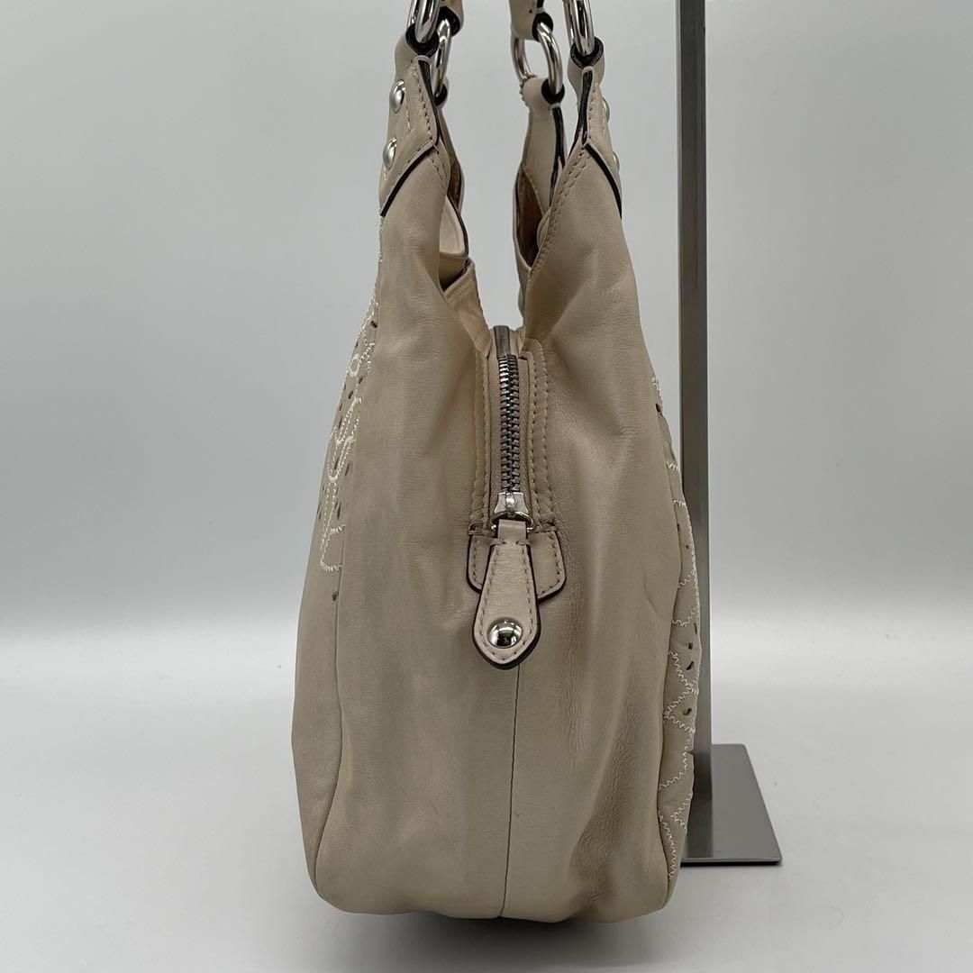まだまだ使える❤︎ COACH トートバッグ マディソン パンチング フラワー COACH フラワーパンチング トートバッグ - メルカリ