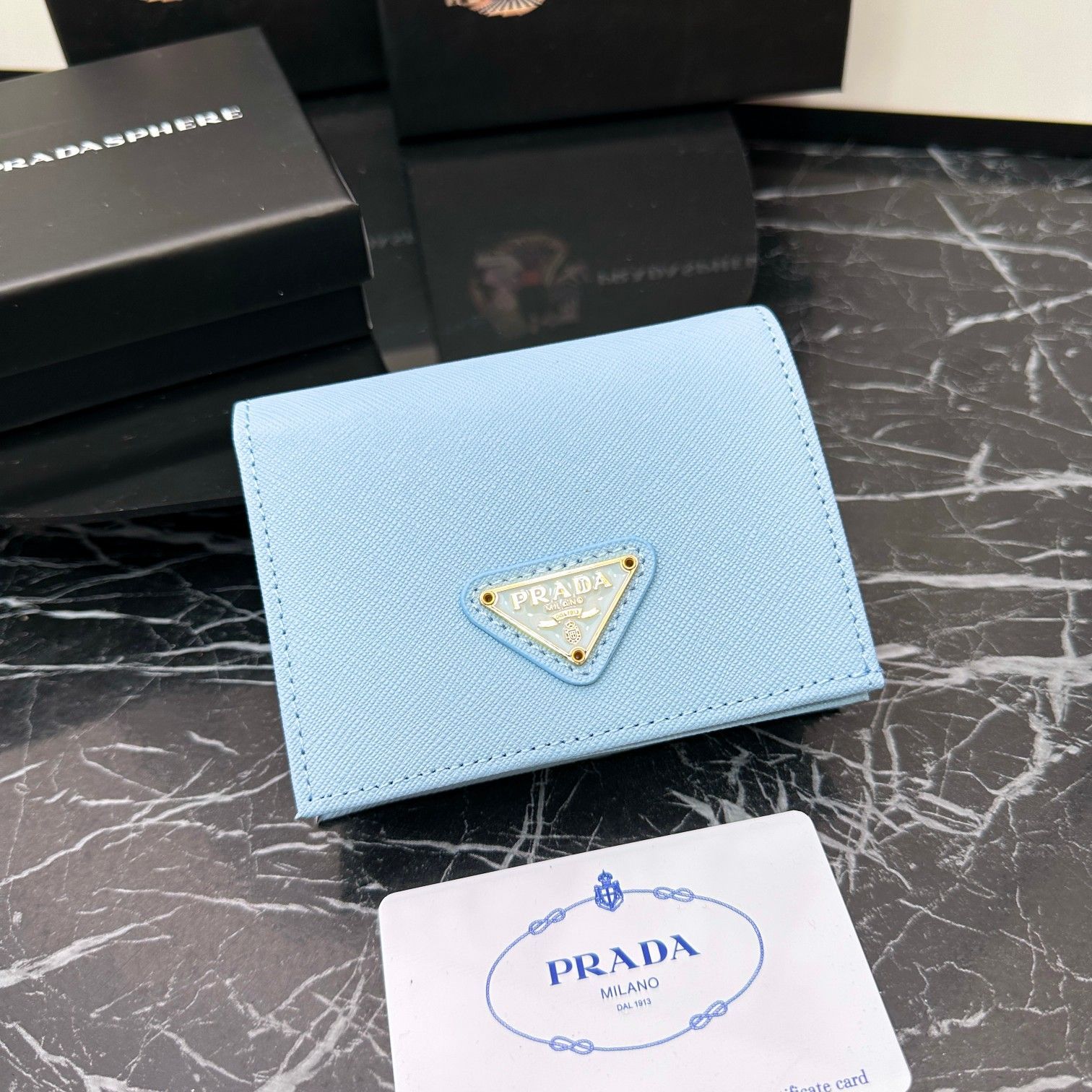 新品未使用】プラダ（Prada）二つ折り財布 スカイブルー110BK - メルカリ