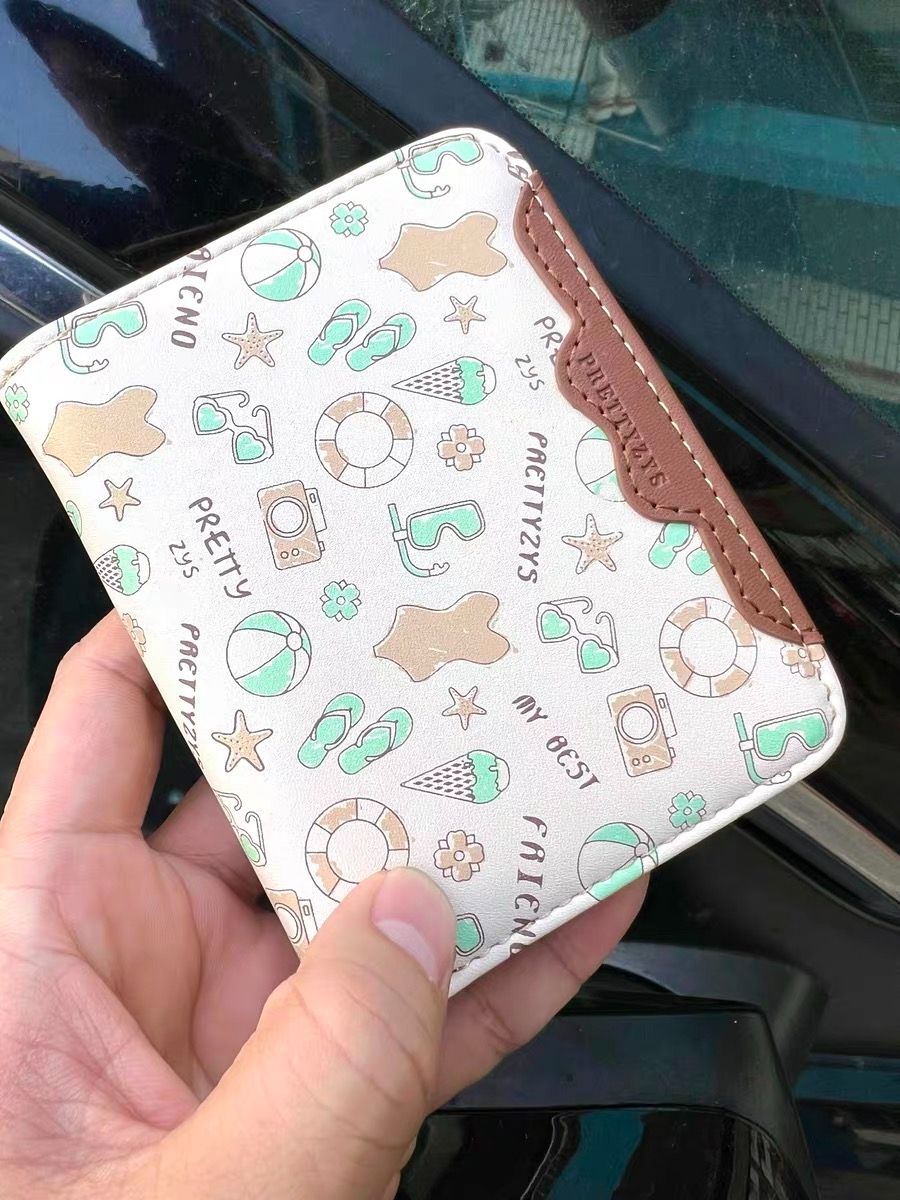 クマのイラストが可愛いピンクのコインケース。 くまちゃんコインケース