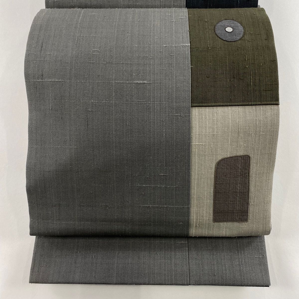 袋帯 秀品 紬地 幾何学模様 丸文 銀彩 灰色 お太鼓柄 正絹