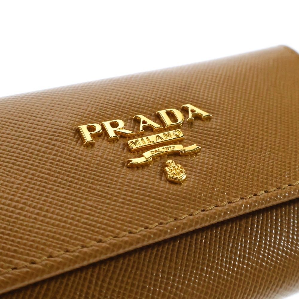 【極美品】PRADA プラダ　6連　キーケース　ゴールド　サフィアーノ PRADA プラダ 6連キーケース リボンモチーフ サフィアーノレザー