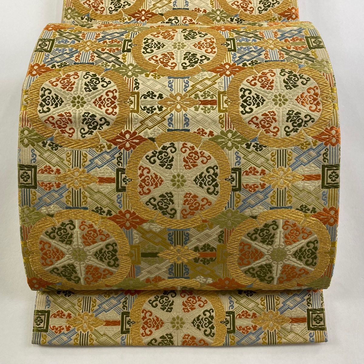 袋帯 龍村晋 落款 華文 幾何学模様 金糸 薄茶色 全通 正絹