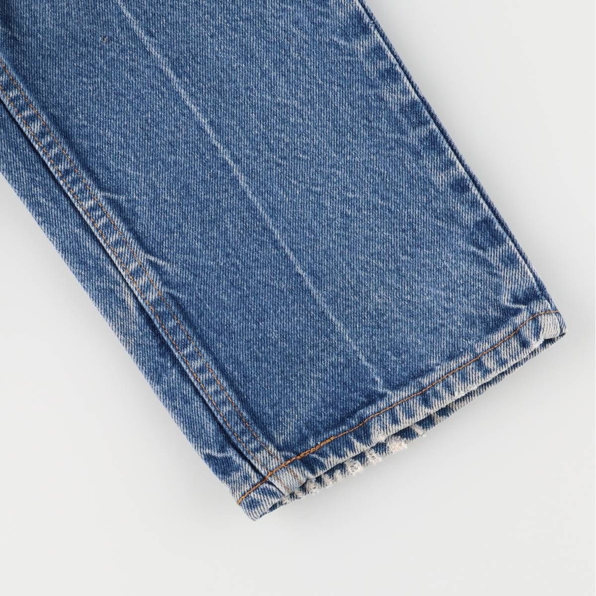 オレンジタブ テーパードデニムパンツ