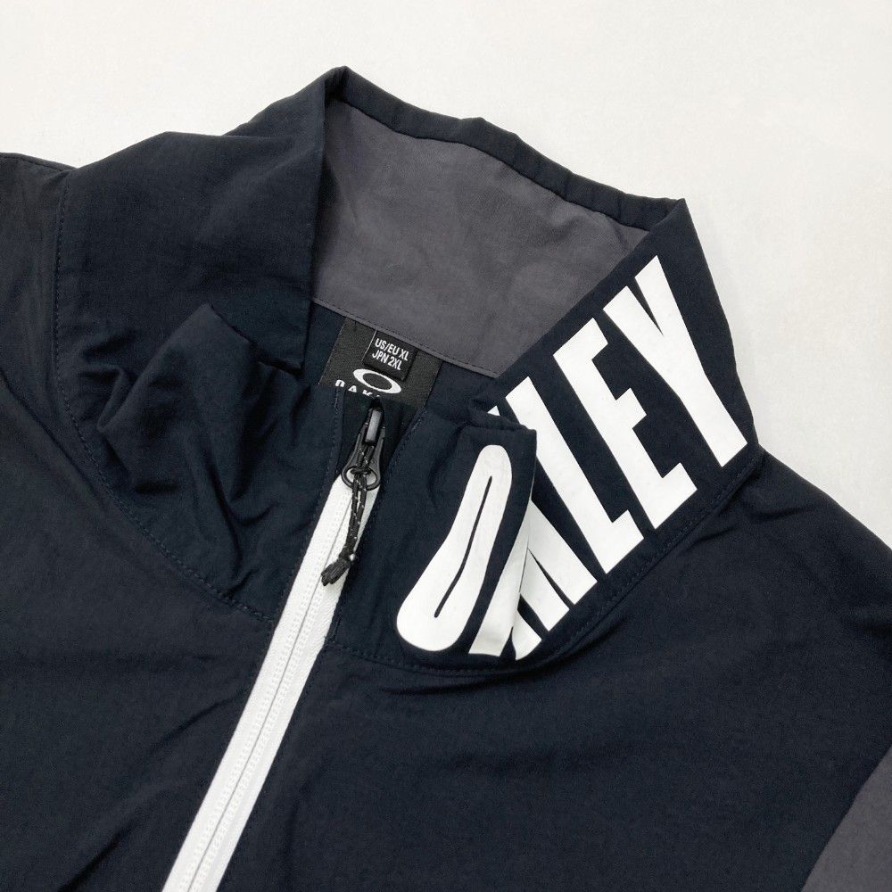 サイズ：2XL OAKLEY オークリー  ジップジャケット  ブラック系 [240101418416] ゴルフウェア メンズ ストスト OAKLEY(オークリー) ジップジャケット ブラック サイズ 2XL