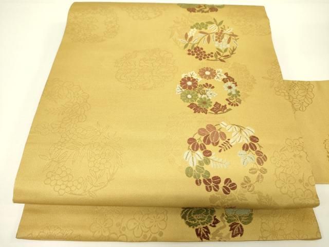 逸品 唐織 装飾花丸文様の袋帯 未使用品 正絹 金糸 ６通柄 乱 ガード加工済 梅 笹 菊 橘 楓 桜 袋帯 新品 正絹 西陣 廣部商事 唐織 薄黄色 唐花 花 舞衣