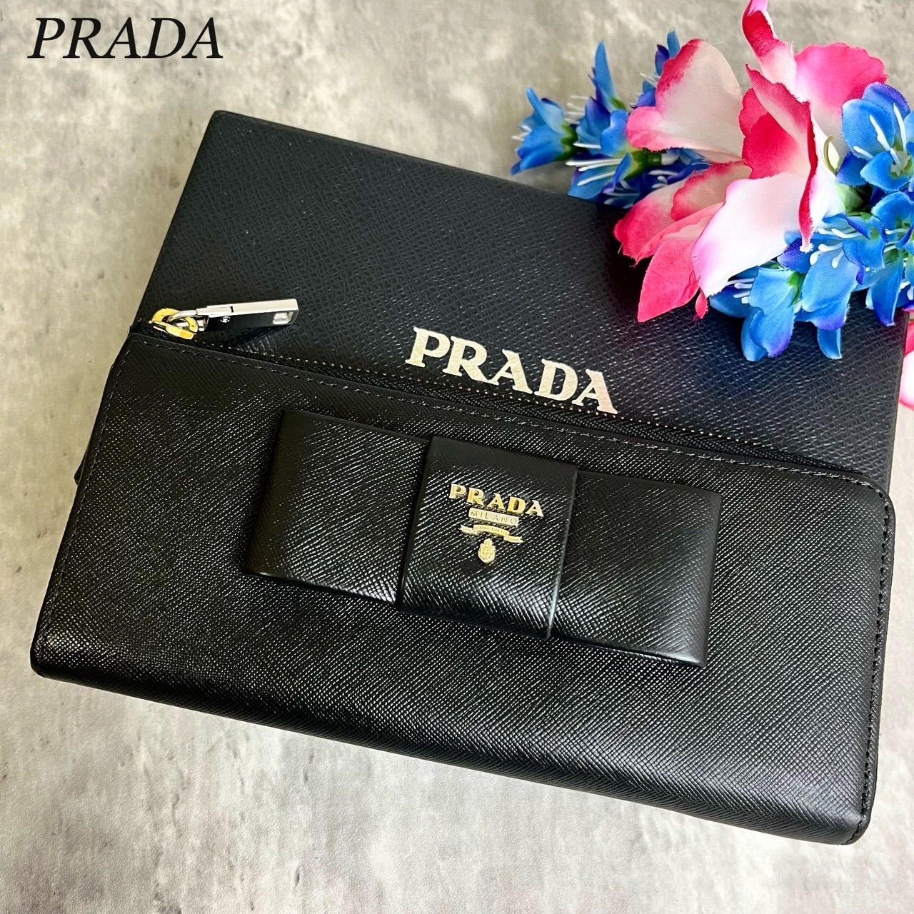 ✨良品✨ PRADA プラダ 長財布 ラウンドファスナー ロングウォレット リボン ロゴ金具 ロゴ型押し カードケース 定期入れ 小銭入れ  サフィアーノレザーレディース ブラック 黒色 - メルカリ