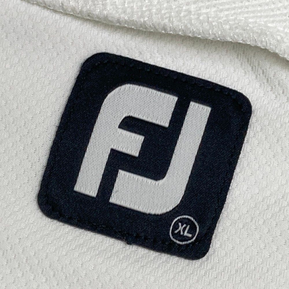 サイズ：XL FOOT JOY フットジョイ 2024年モデル ハイネック半袖Tシャツ ビッグロゴ  ホワイト系 [240101435013] ゴルフウェア メンズ ストスト サイズ：XL FOOT JOY フットジョイ 2024年モデル ハイネック半袖