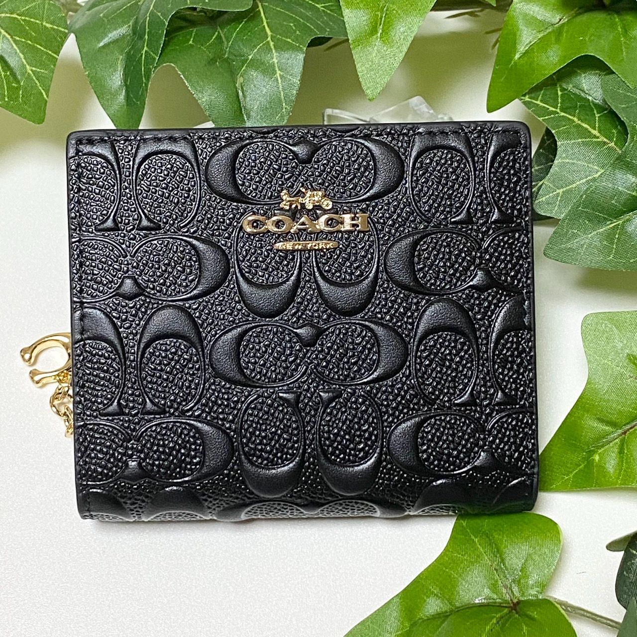 COACH ブラック 二つ折り財布 エンボス加工