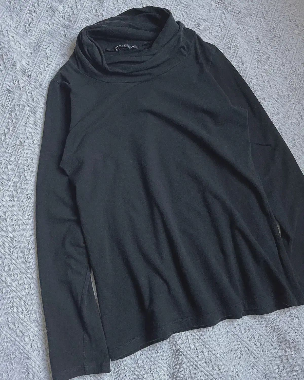 draped turtleneck