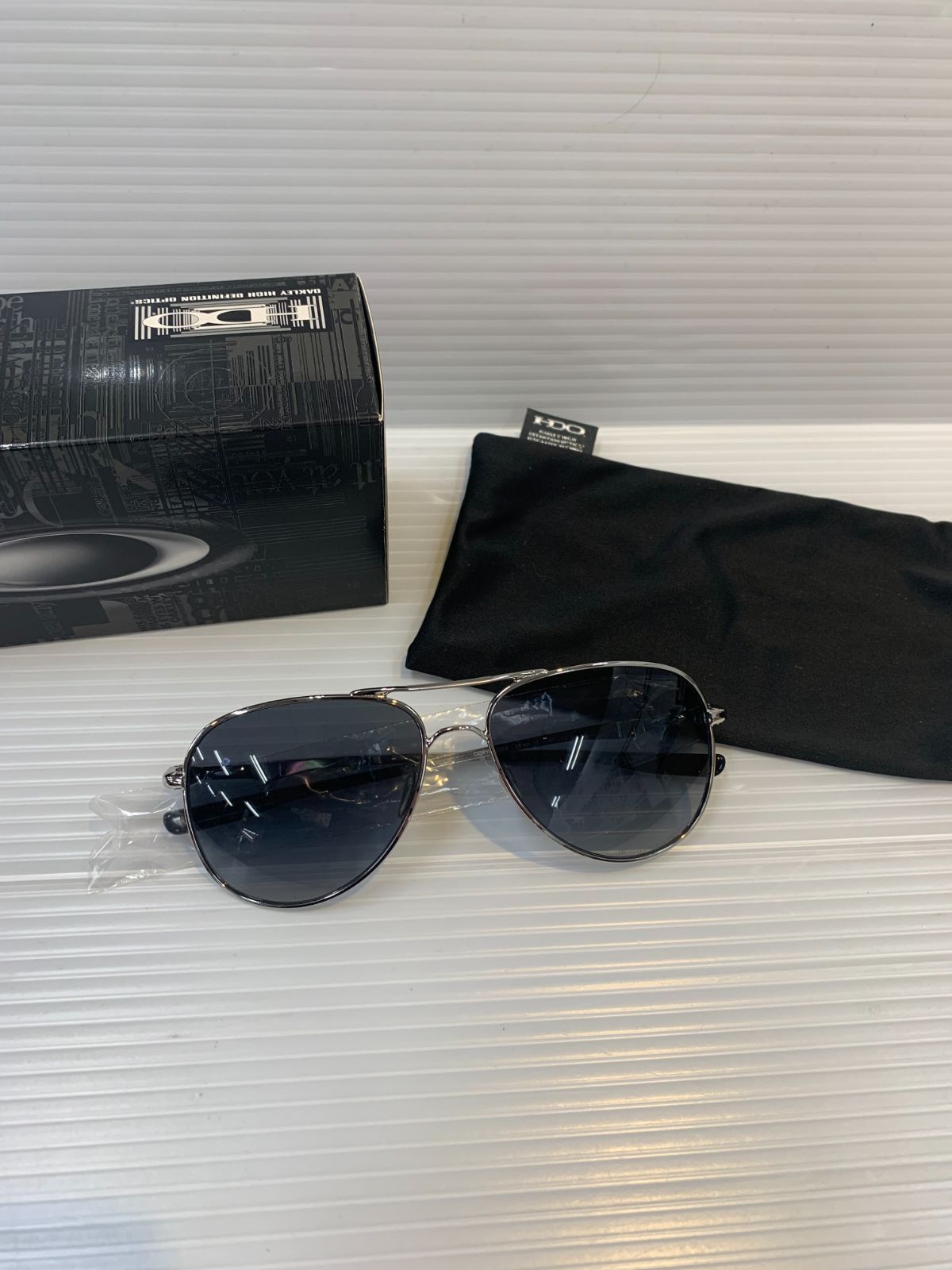 81.OAKLEY Elmont OO4119-258 偏光サングラス【店舗併売品】