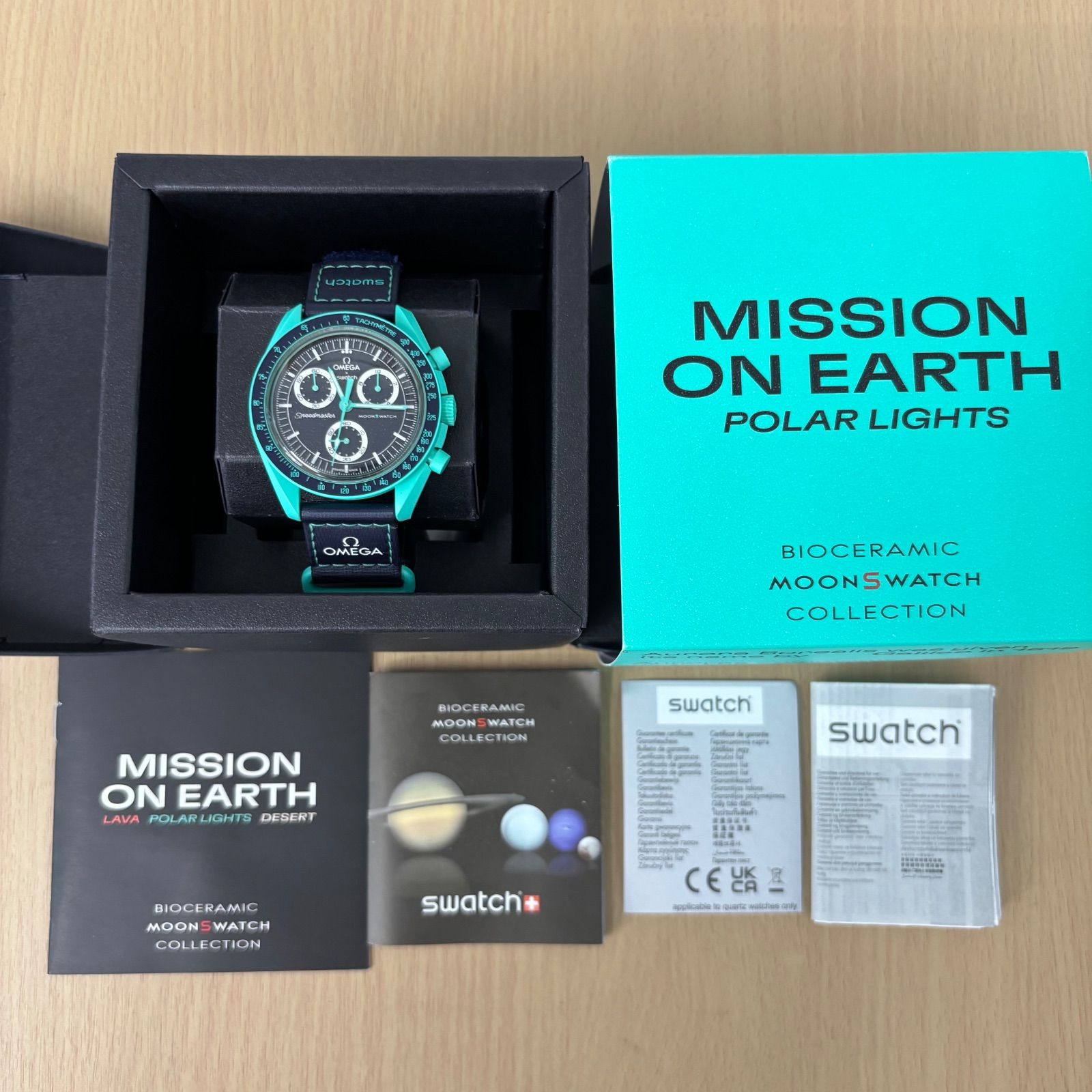 オメガスウォッチ オーロラ MISSION ターコイズ MISSION ON EARTH