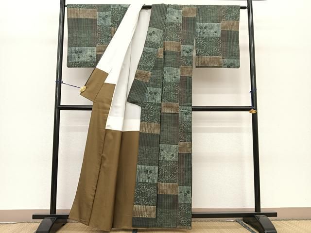 平和屋着物○伝統工芸士 七代目 吉澤与市 紬 絞り 型染め 切嵌更紗花文  