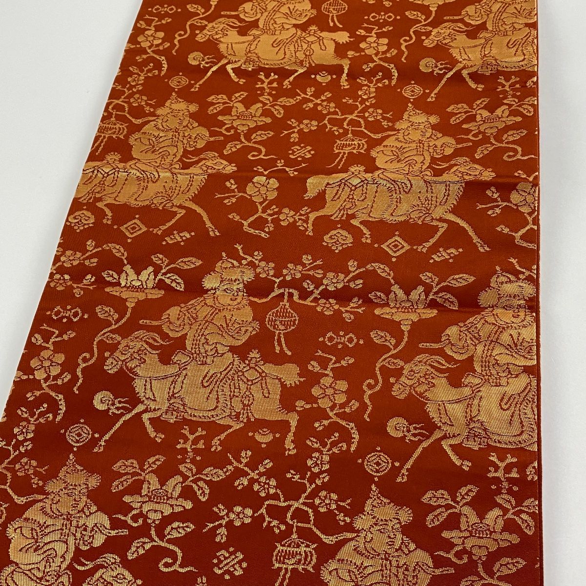 袋帯 龍村晋 落款 胡服遊行錦 人馬 枝花 箔 赤茶 正絹