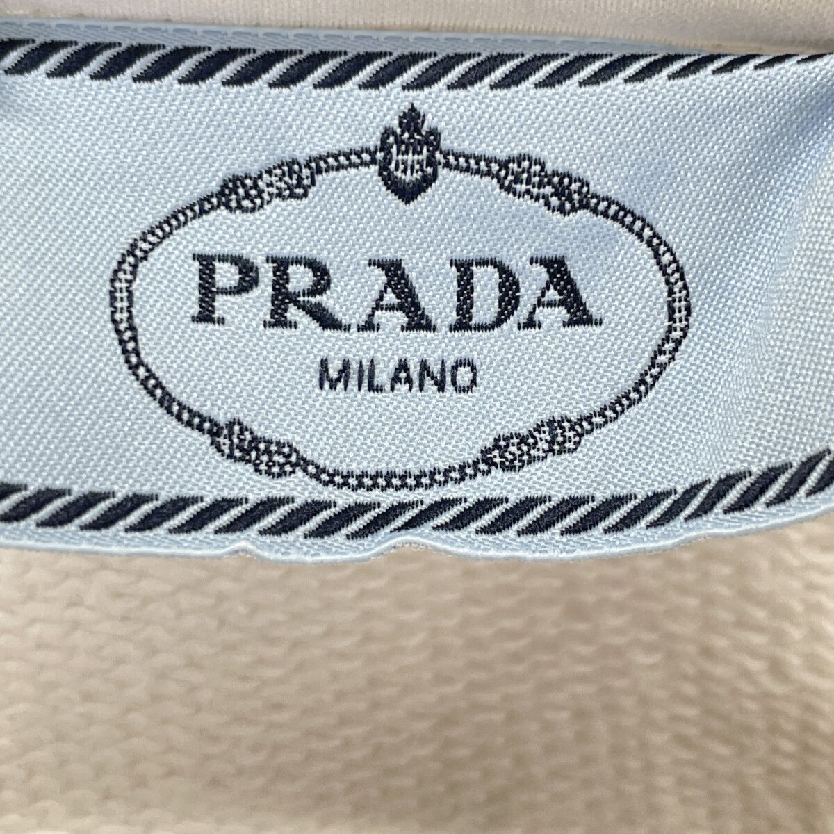 PRADA プラダ ﾎﾜｲﾄ 138590 ﾄﾗｲｱﾝｸﾞﾙｸﾛｯﾌﾟﾄﾞ ｼﾞｯﾌﾟｱｯﾌﾟﾊﾟｰｶｰ M - メルカリ