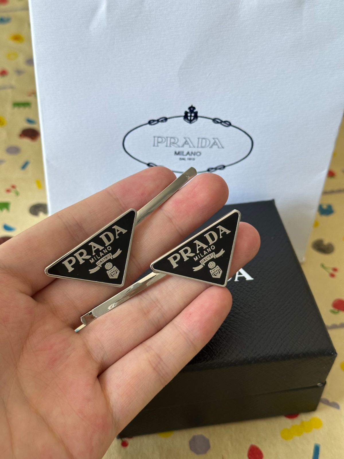 PRADA トライアングル ヘアピン 2個セット PRADA トライアングル ヘアピン 2個セット 刻印あり! - メルカリ