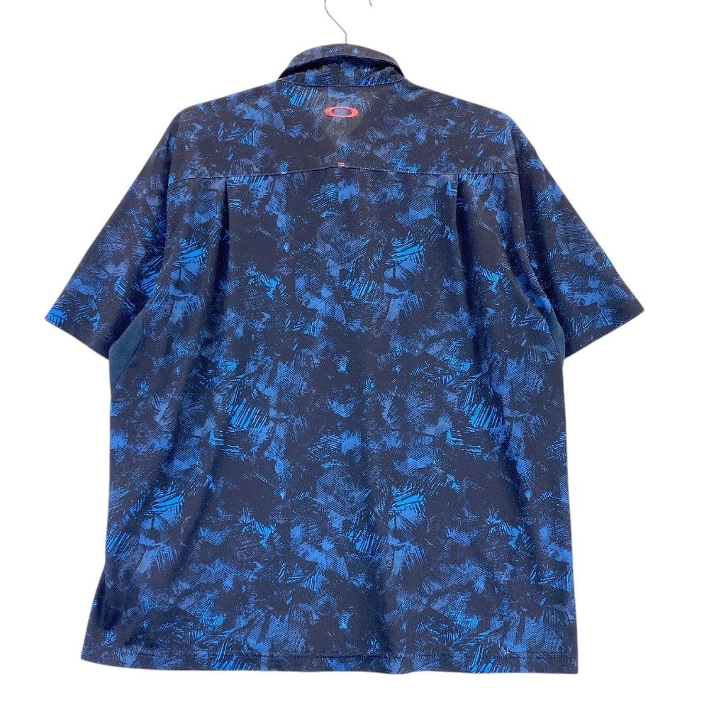 サイズ：XL OAKLEY オークリー 433627JP 半袖ポロシャツ ボタンダウン 総柄 ネイビー系 [240101421949] ゴルフウェア メンズ ストスト サイズ：XL OAKLEY オークリー 433627JP 半袖ポロシャツ ボタン
