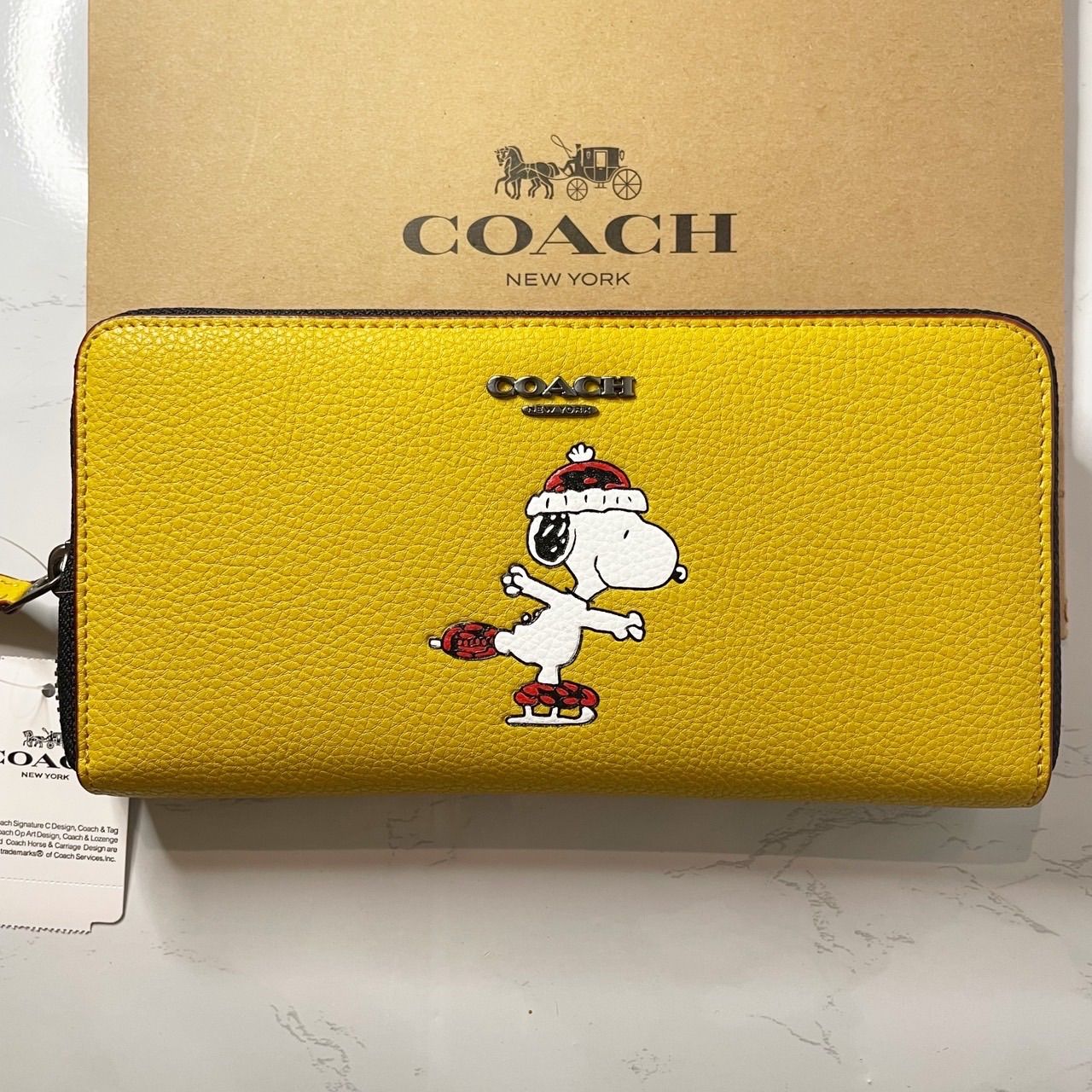 COACH X PEANUTS アコーディオンウォレット・スヌーピー モチーフ