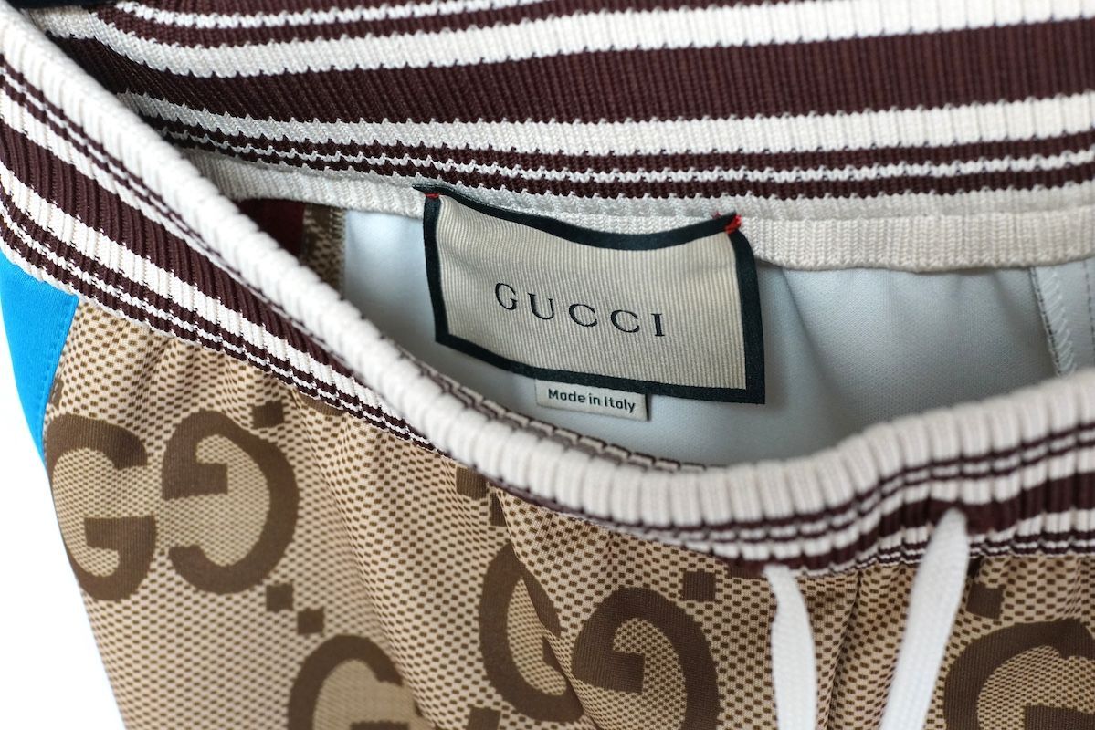 【GUGGI】（グッチ）ジャンボ GG プリント パンツ Gucci ジャンボ GG トラックパンツ | ニュートラル | FARFETCH JP