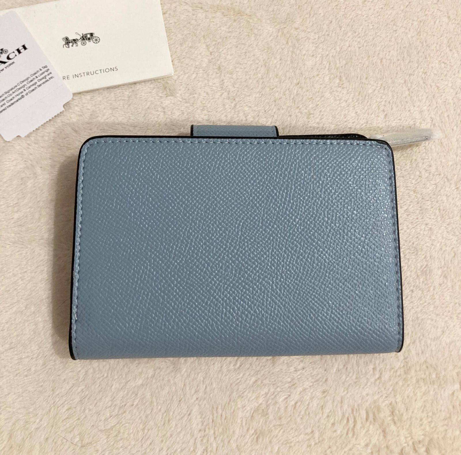 新品】COACH 二つ折り財布 ブルー 水色 - メルカリ