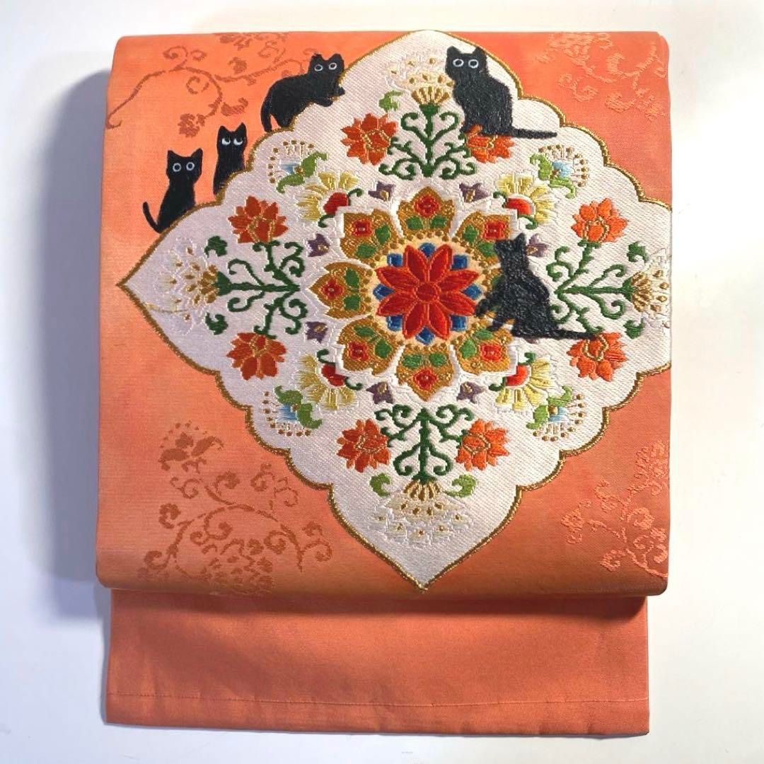 4k780 名古屋帯 絹 唐織 正倉院文様 猫 ピンク 金色 白 黒 赤 緑 花柄  