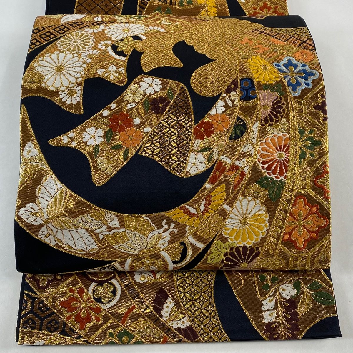 袋帯 秀品 振袖向き 熨斗目取花文 束ね熨斗 草花 金糸 箔 黒 六