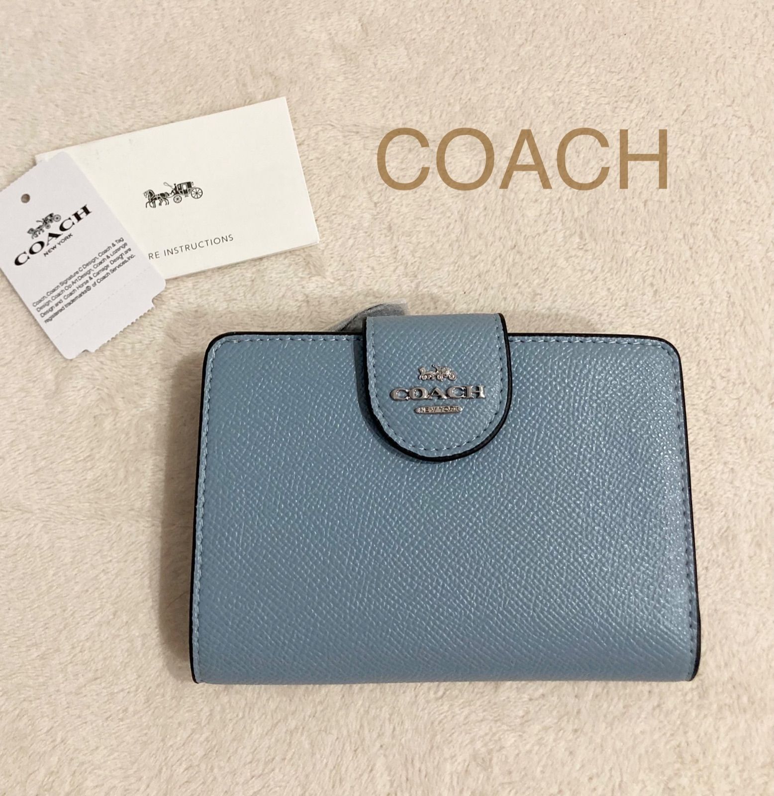 新品】COACH 二つ折り財布 ブルー 水色 - メルカリ