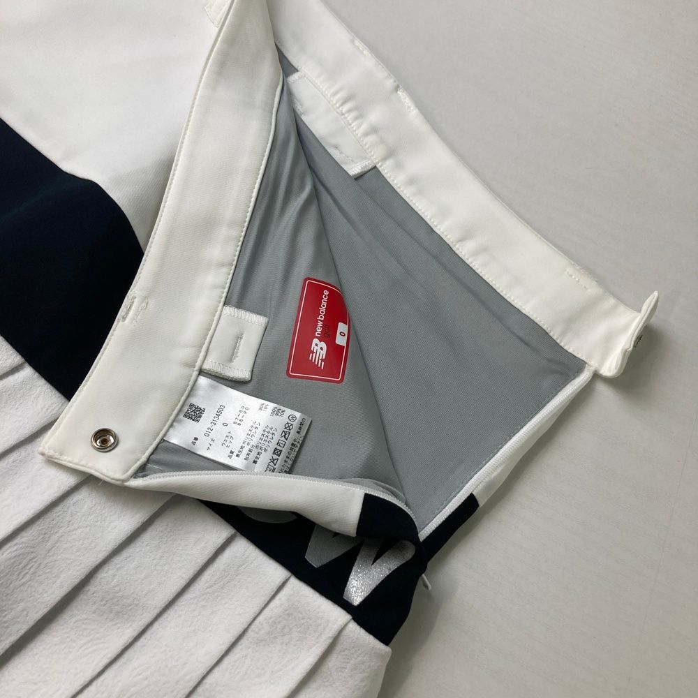 サイズ：1 NEW BALANCE GOLF ニューバランス 2023年モデル インナー付 プリーツ切替スカート 総柄 ホワイト系 [240101434252] ゴルフウェア レディース ストスト NEW BALANCE GOLF ニューバランス 2023年モデル インナー付