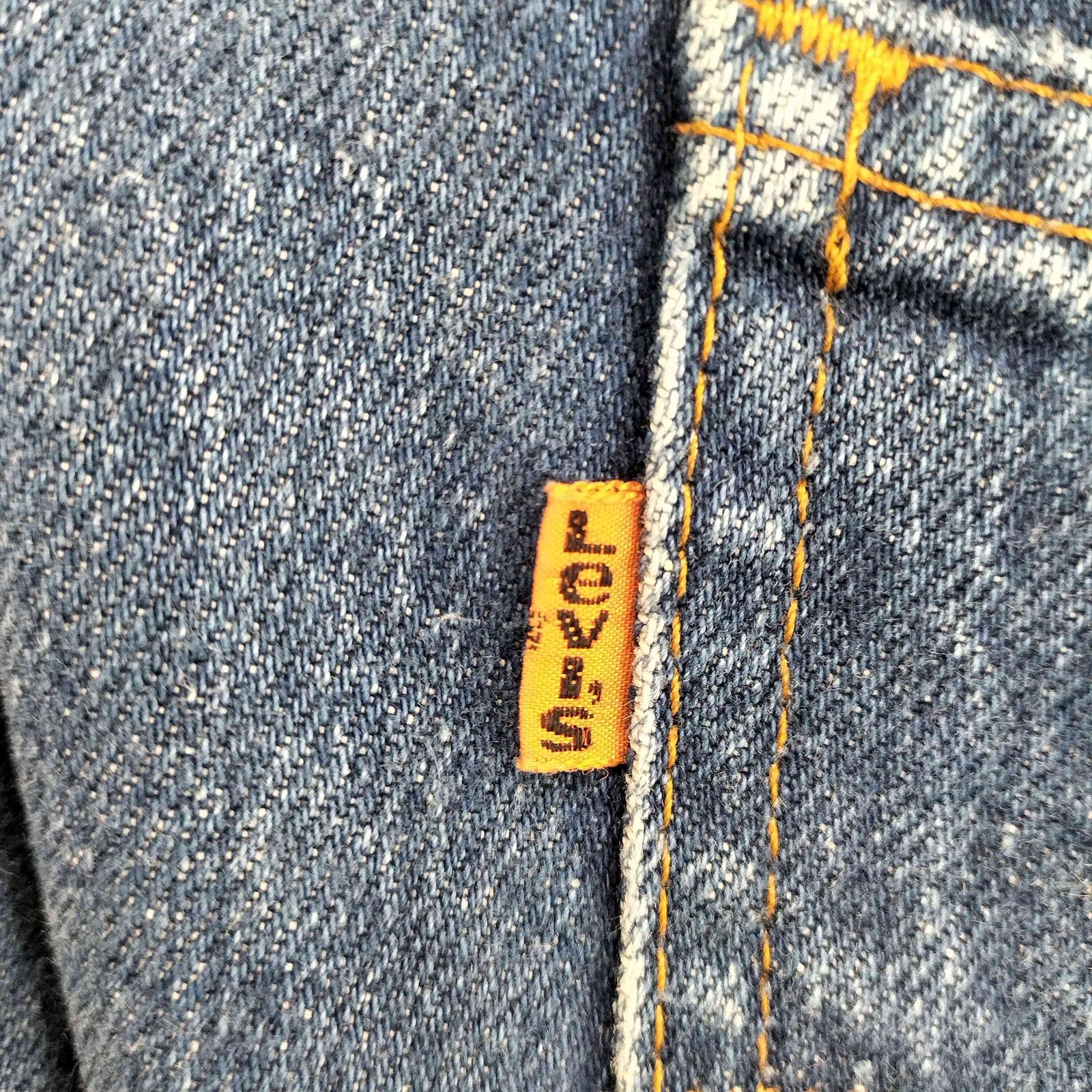 オレンジタブ ジップフライデニムパンツ