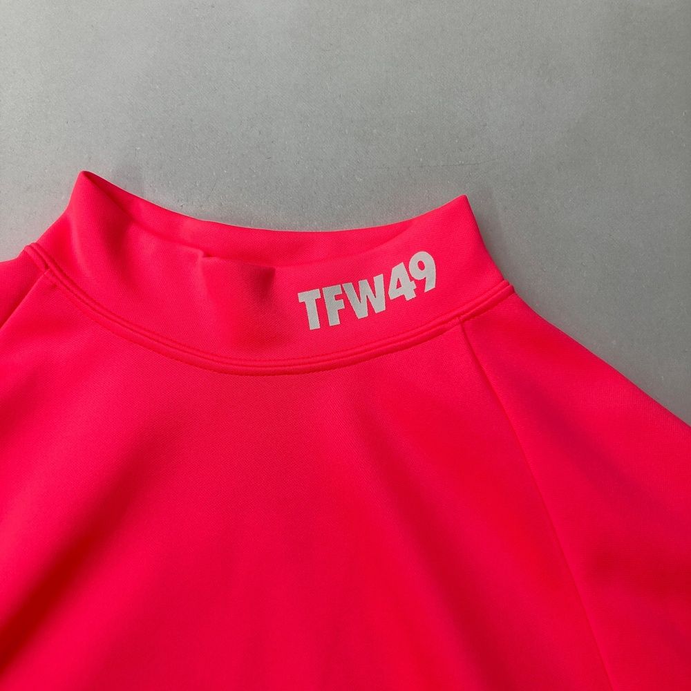 サイズ：M TFW49 ティーエフダブリューフォーティーナイン  ハイネック 長袖Tシャツ  ピンク系 [240101466090] ゴルフウェア レディース ストスト サイズ：M TFW49 ティーエフダブリューフォーティーナイン