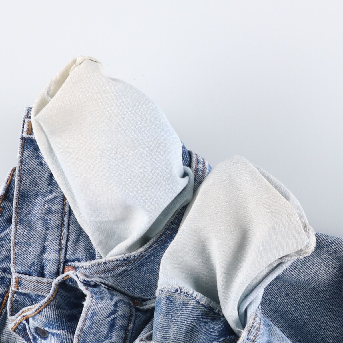 オレンジタブ テーパードデニムパンツ