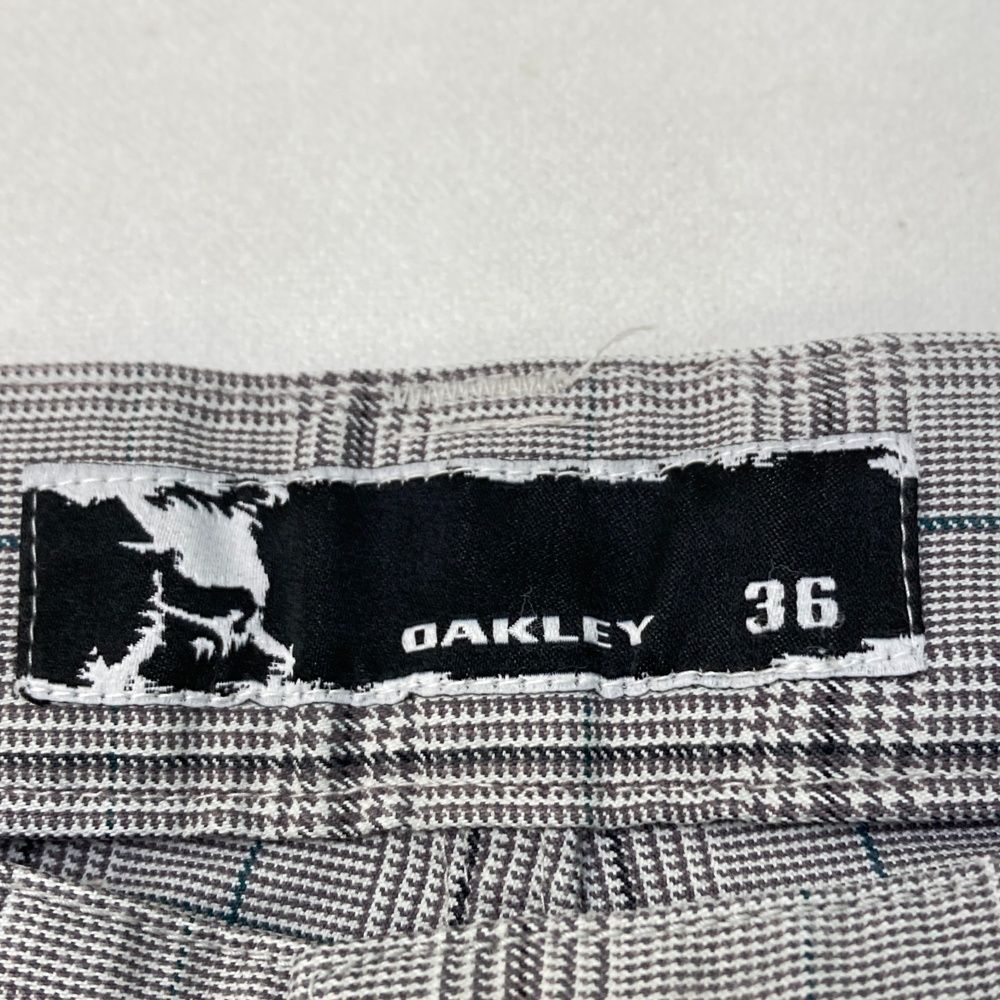 サイズ：36 OAKLEY オークリー 421828JP ロングパンツ スカル刺繍 チェック柄 グレー系 [240101421267] ゴルフウェア メンズ ストスト サイズ：36 OAKLEY オークリー 421828JP ロングパンツ スカル